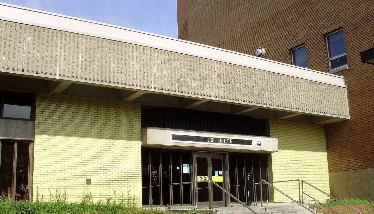 Joliette Montreal Metro station platform with tiled walls and yellow line on platform edge