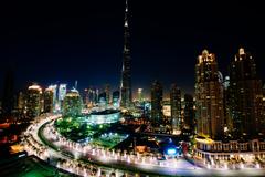 Long exposure photo of Burj Khalifa in Dubai at night with glowing lights and circular light trails