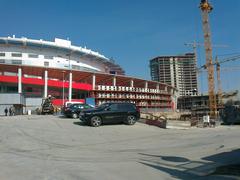Construction work on Aviakonstruktora Sukhogo Street with machinery and building materials