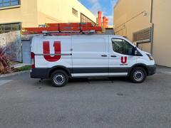 Ford Transit cable service van parked at San Francisco State University campus