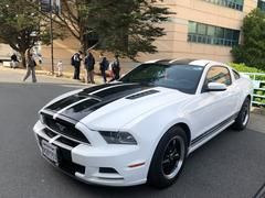 Car meetup at San Francisco State University with various classic and custom cars parked outdoors