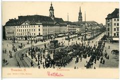 Historic black and white photo of Hauptstraße street with the Golden Rider statue in Dresden, 1904