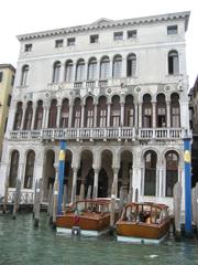 Venice canal with gondolas and historic buildings including Ca' Loredan