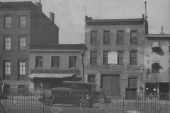 Historic black and white photo of 51-53 Christopher Street, Greenwich Village, New York City in 1928