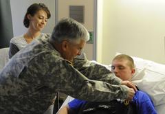 Chief of Staff Gen. George W. Casey Jr. presenting Purple Heart to Spc. Logan Hawthorn at Brooks Army Medical Center