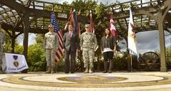 Deputy Secretary of Defense Ashton B. Carter standing beside Pfc. Dakota Cowart during Purple Heart ceremony at BAMC, San Antonio