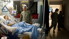 U.S. Army Chief of Staff Gen. George W. Casey Jr. talking with a soldier at Brooks Army Medical Center with medical staff nearby