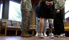 Soldier with mother and another soldier talking to Chief of Staff of the Army Gen. George W. Casey, Jr. at Brooke Army Medical Center
