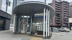 Hanshin Sakuragawa Station entrance with vibrant signage and urban surroundings