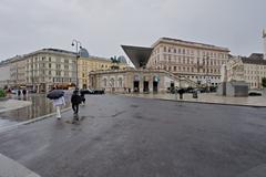 Albertinaplatz square in Vienna during daytime with historical buildings and blue sky