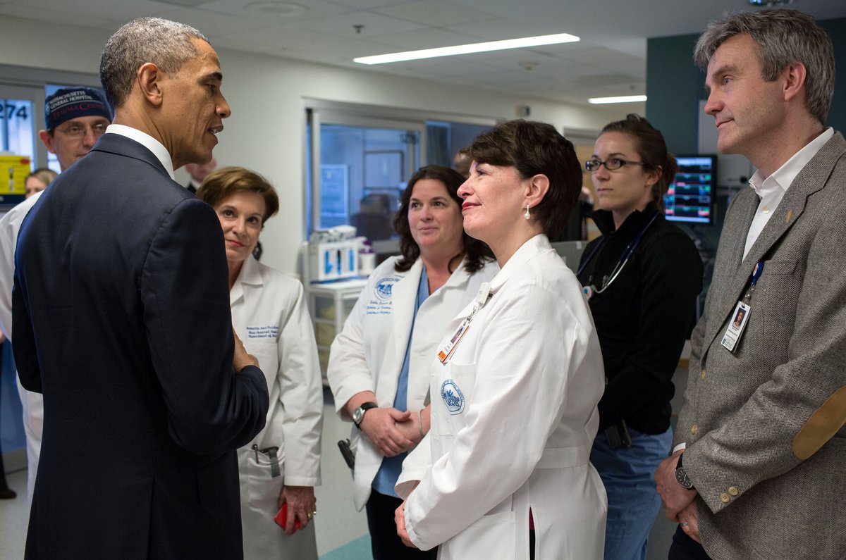 United States President Barack Obama talking with staff at Massachusetts General Hospital during a visit to meet victims of the 2013 Boston Marathon bombings