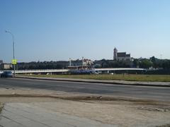 White Bridge in Vilnius over a river with blue sky