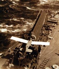 USS Wisconsin BB-64 crew checking control surface of drone before takeoff