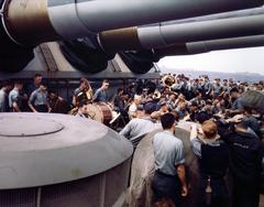 Band concert under the after 16-inch guns of battleship USS Wisconsin (BB-64) at sea with Pacific Fleet, circa 1945