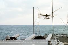 Pioneer remotely piloted vehicle being recovered in a net near the stern of battleship USS Wisconsin during Operation Desert Shield