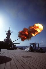 Projectile being fired from Mark 7 16-inch-50-caliber gun at No. 2 turret on battleship USS Wisconsin BB-64 during gunnery exercises in Operation Desert Shield