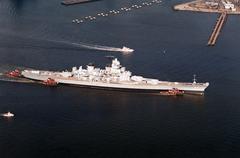 Aerial starboard side view of the Iowa class battleship Wisconsin BB-64 being towed past Norfolk Naval Base