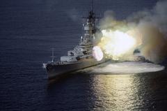 USS Wisconsin battleship firing 16-inch guns during firepower demonstration in Gulf of Mexico