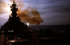 USS Wisconsin battleship firing 5-inch/38-caliber gun at Iraqi shore target during Operation Desert Storm 1991