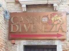 Venice casino sign with buildings and canal in the background