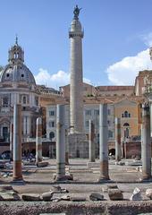 Trajan's Forum in Rome featuring Trajan's Column and Basilica Ulpia under a blue sky