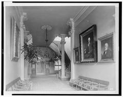 Hallway interior of Pennsylvania Hospital in Philadelphia with arched ceilings and doors along the corridor