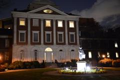 Nighttime view of Pennsylvania Hospital in Philadelphia with illuminated entrance and streetlights