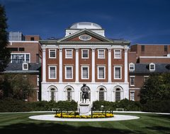 Historic Pennsylvania Hospital building with brick facade and American flags