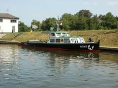 Staustufe Güdingen lock and dam on a river with green surroundings