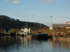 Staustufe Güdingen dam and lock on a river with surrounding trees and infrastructure