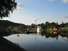View of Staustufe Güdingen dam with water flowing over the sluices