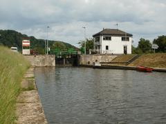Staustufe Güdingen dam and lock on the Saar River with surrounding greenery