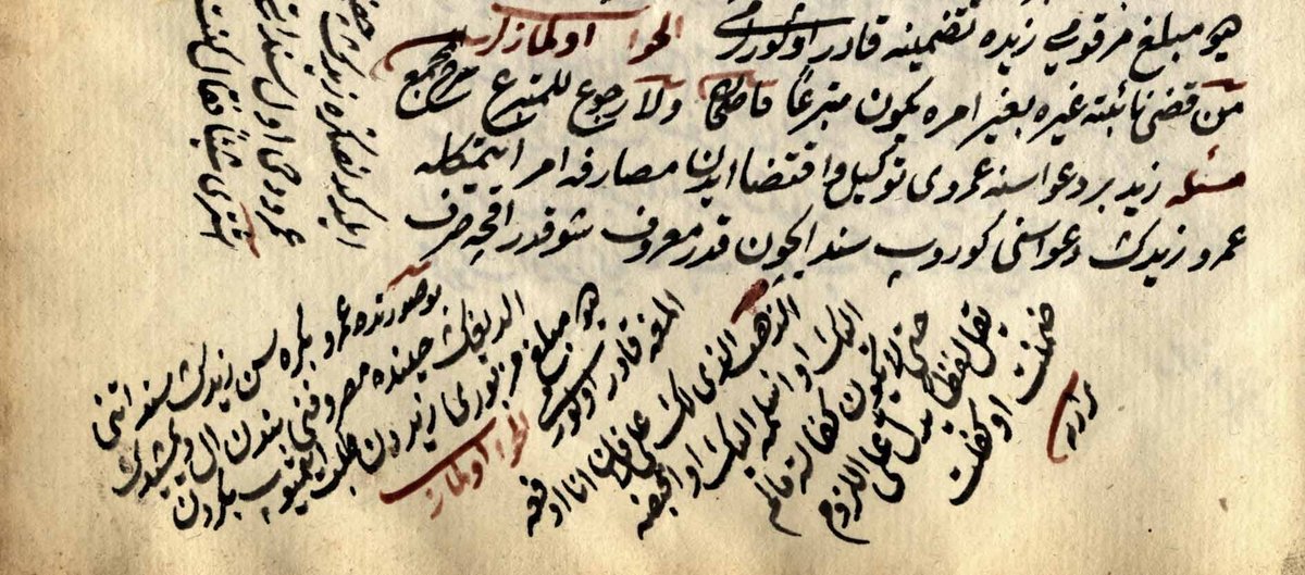 Open antique book with handwritten text and annotations from the second half of the 16th century