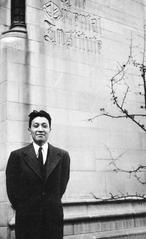 Chen Mengjia, Chinese poet and archaeologist, standing outside the University of Chicago Oriental Institute