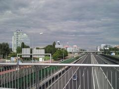 Street view of Einsteinova in Bratislava with buildings and parked cars