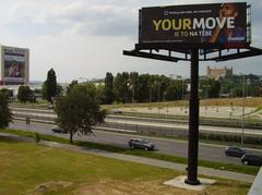Large billboard advertising event at Incheba Expo in Bratislava with a red and white color scheme