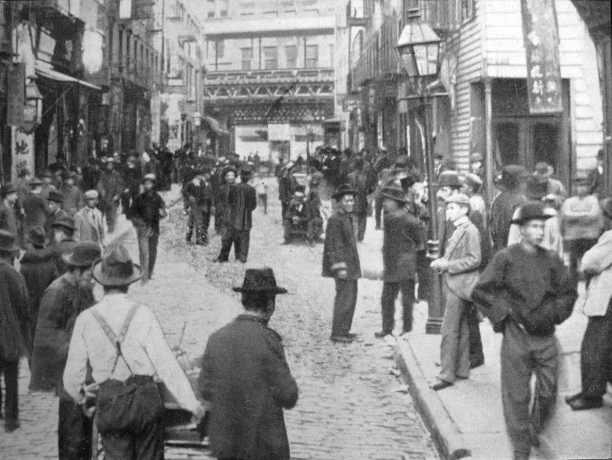 Historical view of Chinatown on Pell Street in New York City on a Sunday in 1899
