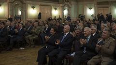 Bosnia-Herzegovina dignitaries and military representatives applauding during NATO Headquarters Sarajevo transfer of authority ceremony
