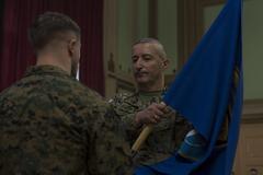 Transfer of authority ceremony at NATO Headquarters Sarajevo with Armed Forces of Bosnia and Herzegovina Sgt. Maj. Krunoslav Zelenika receiving unit guidon from U.S. Marine Corps Cpl. Kyle Elliot