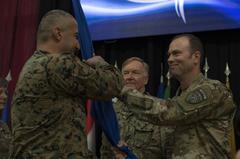 Brig. Gen. William J. Edwards passes unit guidon to Sgt. Maj. Krunoslav Zelenika during NATO Headquarters Sarajevo transfer of authority ceremony