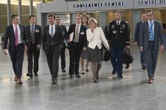 Acting U.S. Secretary of Defense Mark T. Esper walking with U.S. Ambassador to NATO Kay Bailey Hutchison at NATO headquarters in Brussels on June 26, 2019