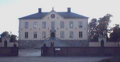 Hässelby Castle main building surrounded by trees