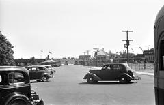 River Road with vintage cars and tram tracks in historical black and white photograph