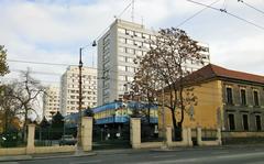 Street view of Dózsa György út in Budapest with buildings and cars