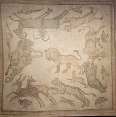 Ancient stone tesserae mosaic depicting a hunting scene with animals