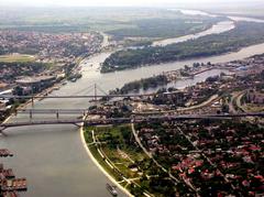 Three Belgrade bridges over the Sava River including Gazela Bridge, Old Railroad Bridge, and New Railroad Bridge with Belgrade Fair dome visible