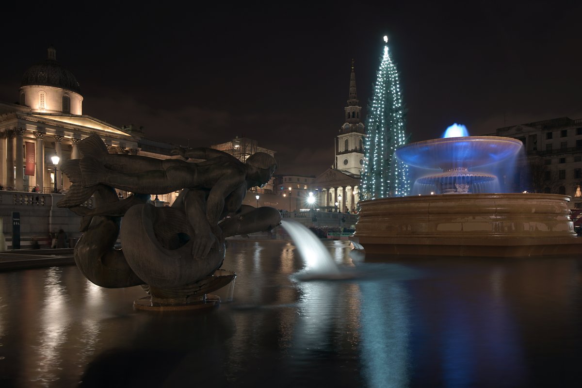 Christmas tree in Trafalgar Square London with festive lights during Christmas 2015