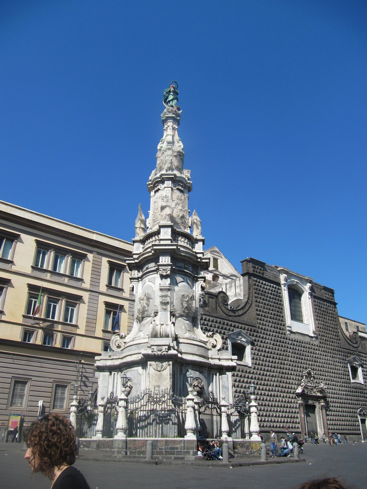 Guglia dell'Immacolata monument in Naples with blue sky in background