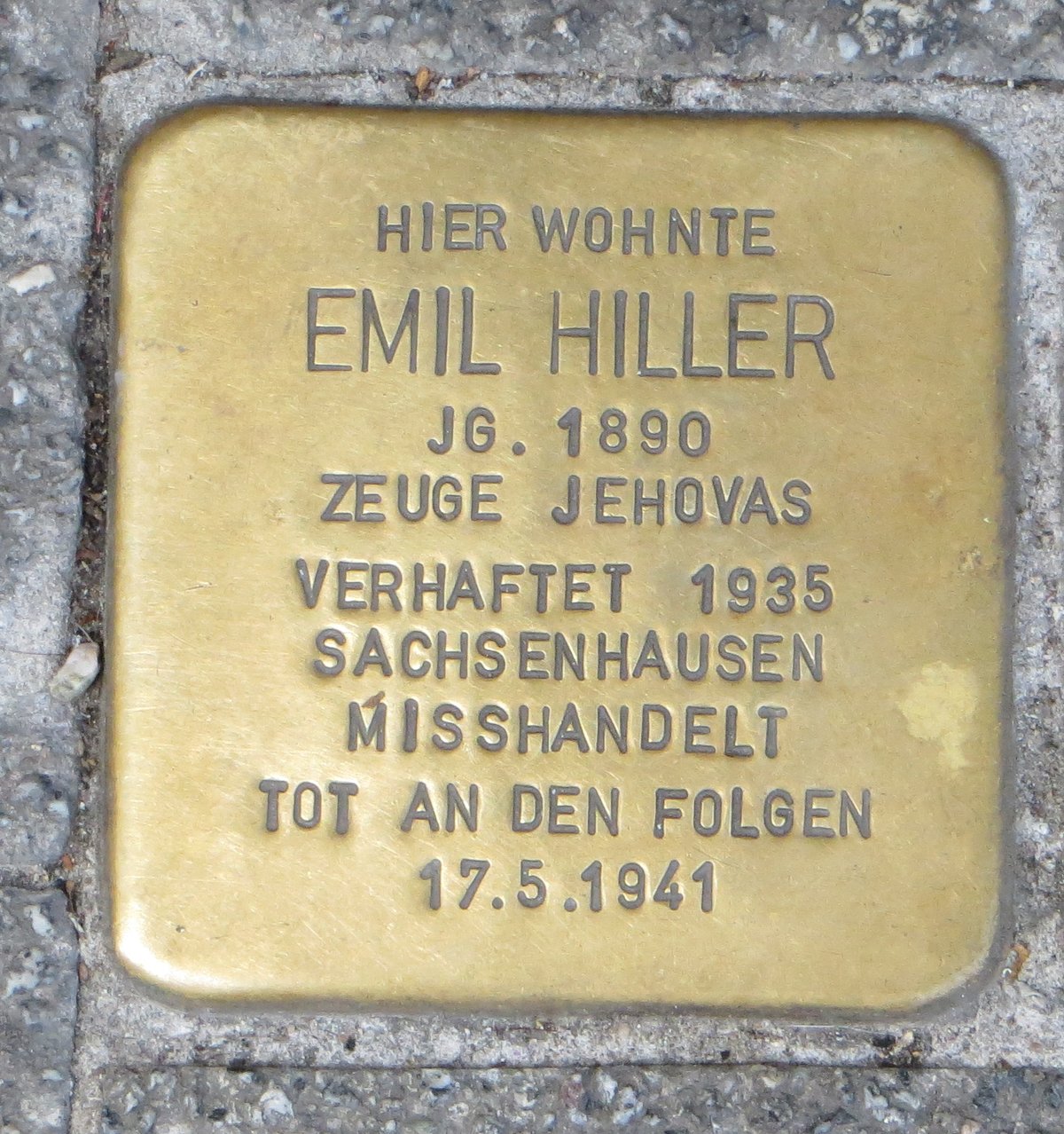 Stolperstein commemorative stone for Emil Hiller in Karlsruhe, Germany, placed on the ground