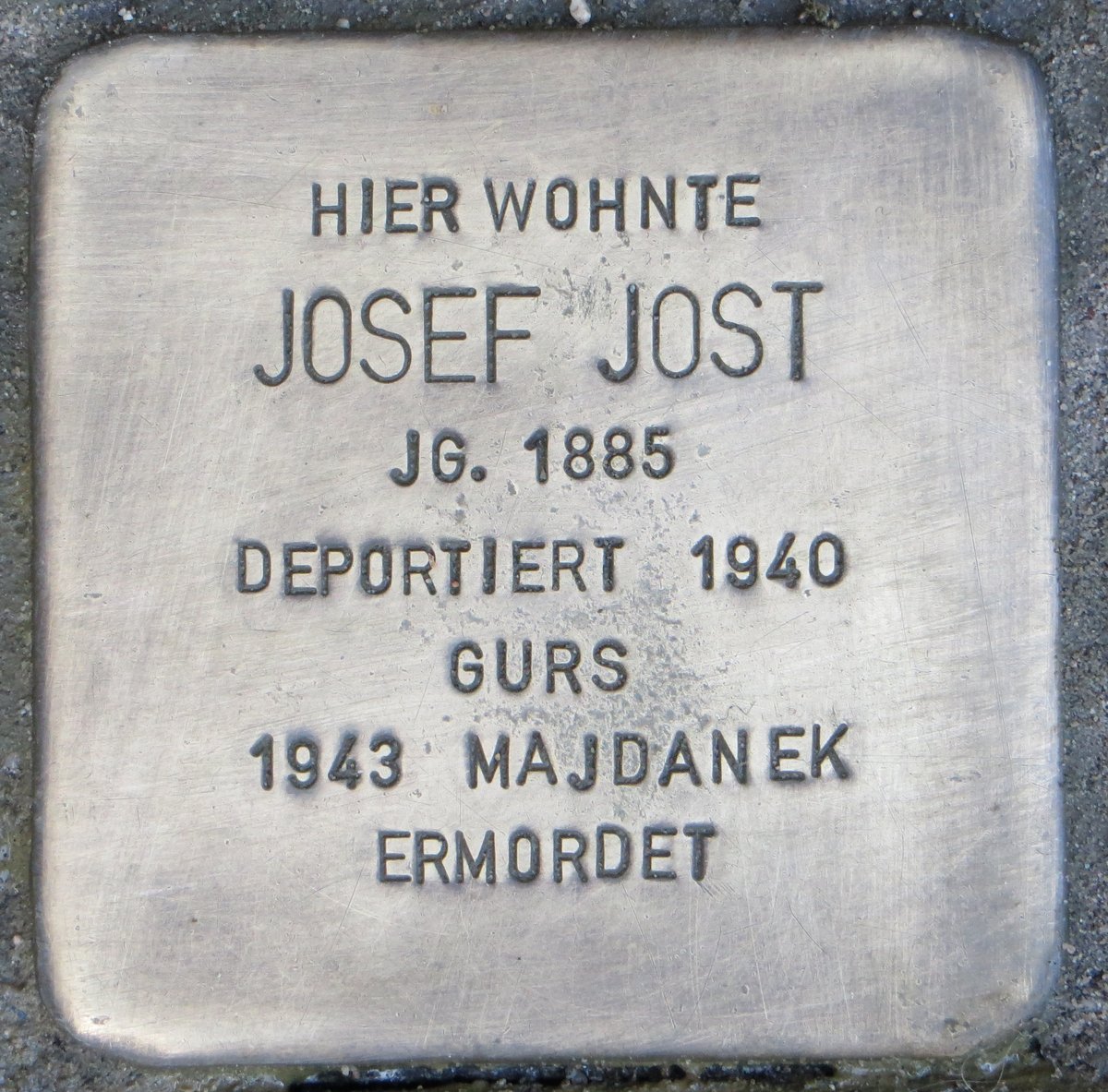 Stolperstein commemorative brass plaque embedded in pavement dedicated to Josef Jost in Karlsruhe, Germany